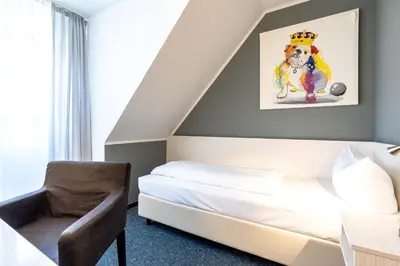 Ein Bett oder Betten in einem Zimmer der Unterkunft Hotel Wandinger Hof