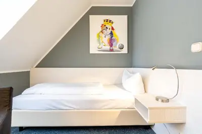 Ein Bett oder Betten in einem Zimmer der Unterkunft Hotel Wandinger Hof