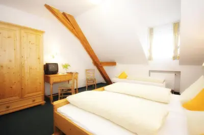 Ein Bett oder Betten in einem Zimmer der Unterkunft Hotel Trasen