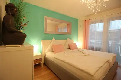 Ein Bett oder Betten in einem Zimmer der Unterkunft Pearl Royale