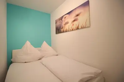 Ein Bett oder Betten in einem Zimmer der Unterkunft Pearl Royale