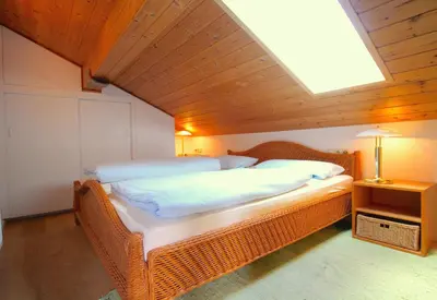 Ein Bett oder Betten in einem Zimmer der Unterkunft Lindenschlösschen & Schlossgarten