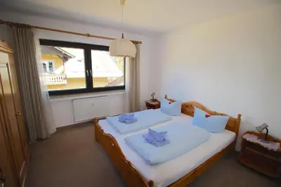 Ein Bett oder Betten in einem Zimmer der Unterkunft Lindenschlösschen & Schlossgarten