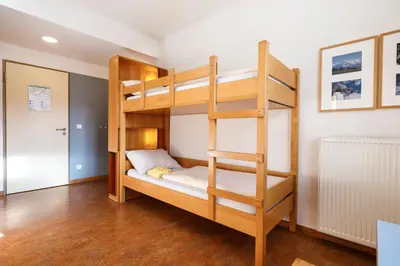 Ein Bett oder Betten in einem Zimmer der Unterkunft Jugendherberge Garmisch-Partenkirchen - membership required!