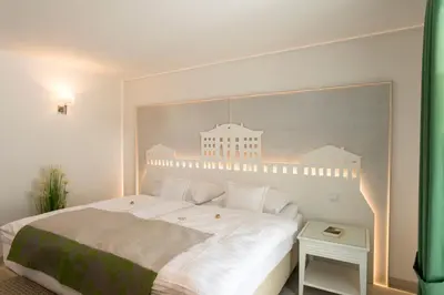 Ein Bett oder Betten in einem Zimmer der Unterkunft Chiemsee Suiten