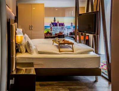 Ein Bett oder Betten in einem Zimmer der Unterkunft Hotel Kreis Residenz München
