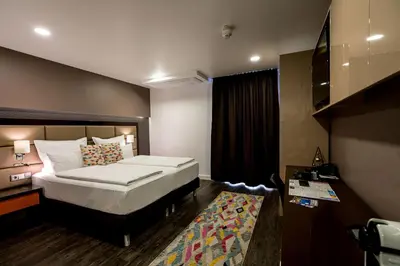 Ein Bett oder Betten in einem Zimmer der Unterkunft Hotel Kreis Residenz München