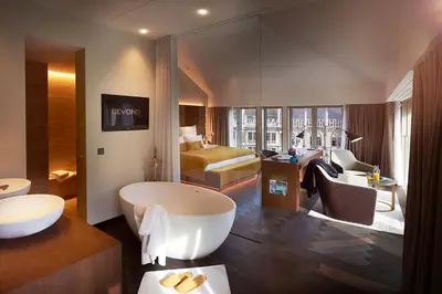 Ein Bett oder Betten in einem Zimmer der Unterkunft BEYOND by Geisel