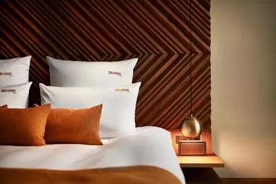 Ein Bett oder Betten in einem Zimmer der Unterkunft BEYOND by Geisel