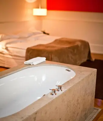 Ein Bett oder Betten in einem Zimmer der Unterkunft CORTIINA Hotel