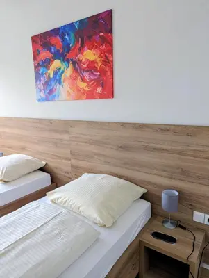 Ein Bett oder Betten in einem Zimmer der Unterkunft Hotel Herian