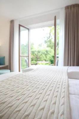 Ein Bett oder Betten in einem Zimmer der Unterkunft Boutique Hotel Reschen