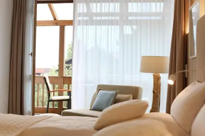 Ein Bett oder Betten in einem Zimmer der Unterkunft Boutique Hotel Reschen