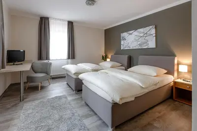 Ein Bett oder Betten in einem Zimmer der Unterkunft sleepIN