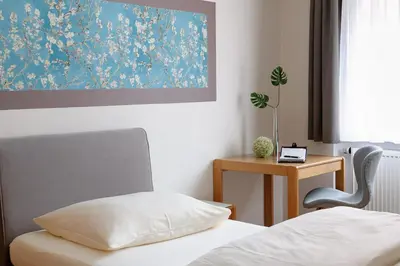 Ein Bett oder Betten in einem Zimmer der Unterkunft sleepIN