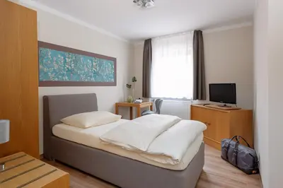 Ein Bett oder Betten in einem Zimmer der Unterkunft sleepIN