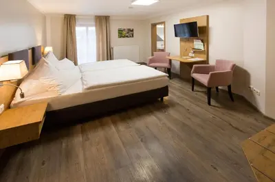 Ein Bett oder Betten in einem Zimmer der Unterkunft Landgasthof Vogelsang OHG