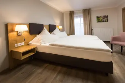 Ein Bett oder Betten in einem Zimmer der Unterkunft Landgasthof Vogelsang OHG
