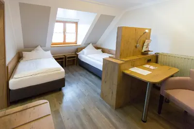 Ein Bett oder Betten in einem Zimmer der Unterkunft Landgasthof Vogelsang OHG