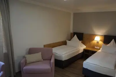Ein Bett oder Betten in einem Zimmer der Unterkunft Landgasthof Vogelsang OHG