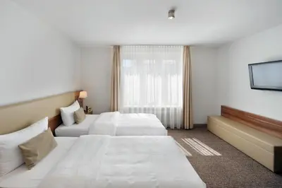 Ein Bett oder Betten in einem Zimmer der Unterkunft Downtown Vi Vadi Hotel
