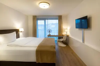Ein Bett oder Betten in einem Zimmer der Unterkunft Downtown Vi Vadi Hotel
