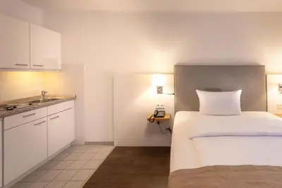 Ein Bett oder Betten in einem Zimmer der Unterkunft Downtown Vi Vadi Hotel
