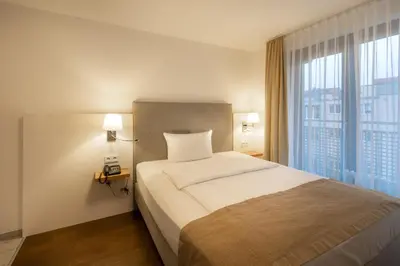 Ein Bett oder Betten in einem Zimmer der Unterkunft Downtown Vi Vadi Hotel