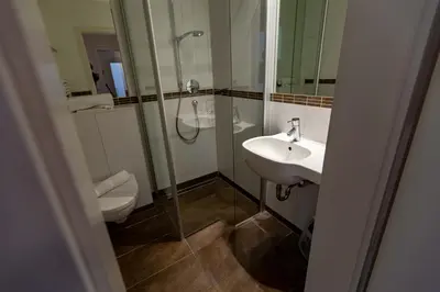 Ein Badezimmer in der Unterkunft Hotel Schyrenhof