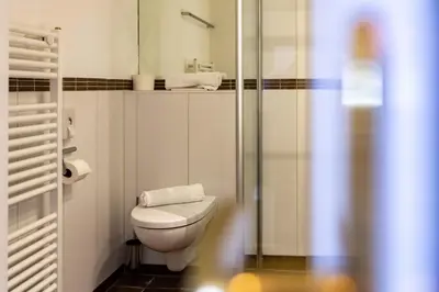 Ein Badezimmer in der Unterkunft Hotel Schyrenhof