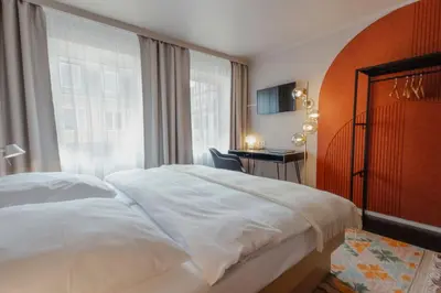 Ein Bett oder Betten in einem Zimmer der Unterkunft Hotel Lux