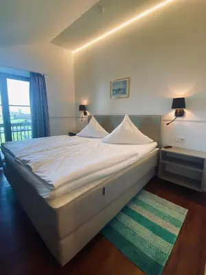 Ein Bett oder Betten in einem Zimmer der Unterkunft Gasthaus - Hotel Alt Fürstätt