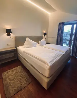 Ein Bett oder Betten in einem Zimmer der Unterkunft Gasthaus - Hotel Alt Fürstätt
