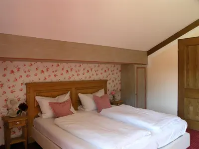 Ein Bett oder Betten in einem Zimmer der Unterkunft Hotel Bachmair Alpina