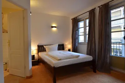 Ein Bett oder Betten in einem Zimmer der Unterkunft Landhaus Hotel Wolfratshausen