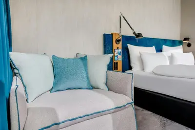 Ein Bett oder Betten in einem Zimmer der Unterkunft Motel One München-Campus