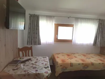 Ein Bett oder Betten in einem Zimmer der Unterkunft Berggasthaus Kraxenberger