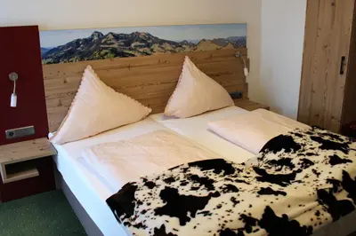 Ein Bett oder Betten in einem Zimmer der Unterkunft Berggasthaus Kraxenberger