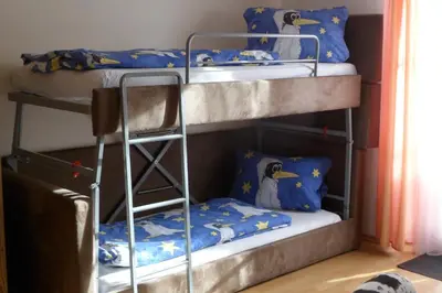 Ein Bett oder Betten in einem Zimmer der Unterkunft Berggasthaus Kraxenberger