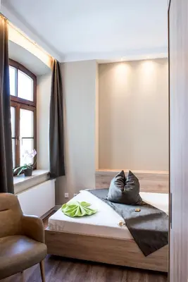 Ein Bett oder Betten in einem Zimmer der Unterkunft Hotel Angerbräu