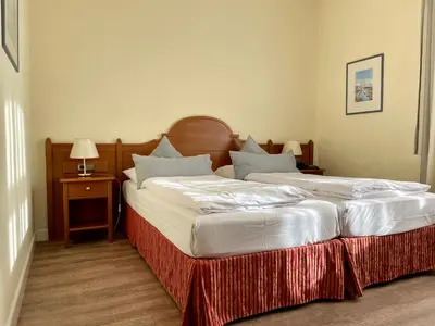 Ein Bett oder Betten in einem Zimmer der Unterkunft Hotel Angerbräu