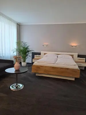 Ein Bett oder Betten in einem Zimmer der Unterkunft Hotel & Apart4you