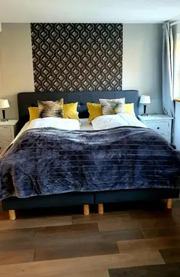Ein Bett oder Betten in einem Zimmer der Unterkunft Schatzbergalm Pension
