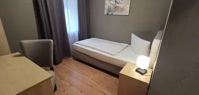 Ein Bett oder Betten in einem Zimmer der Unterkunft Hotel Gasthof Krone
