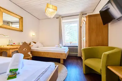 Ein Bett oder Betten in einem Zimmer der Unterkunft Hotel Waldgasthof Buchenhain