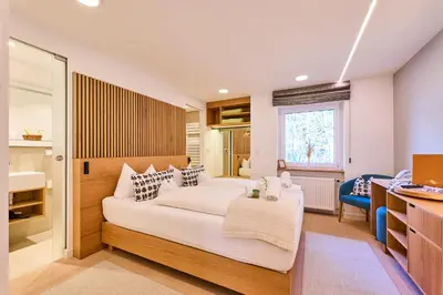 Ein Bett oder Betten in einem Zimmer der Unterkunft Hotel Waldgasthof Buchenhain