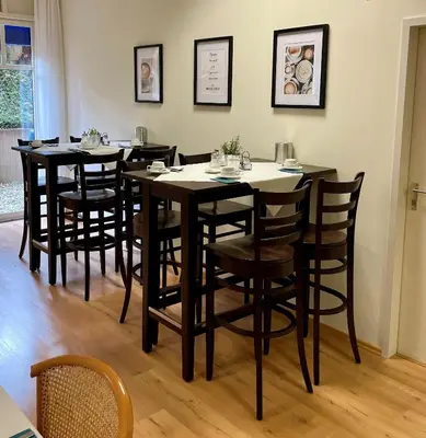 Ein Restaurant oder anderes Speiselokal in der Unterkunft Ambassador Apparthotel