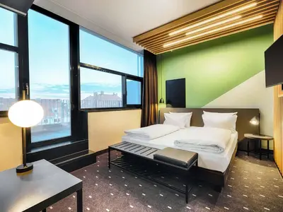 Ein Bett oder Betten in einem Zimmer der Unterkunft B&B Hotel München-Moosach
