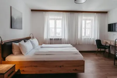 Ein Bett oder Betten in einem Zimmer der Unterkunft Hotel Garni Kern