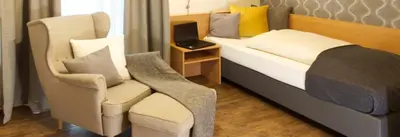 Ein Bett oder Betten in einem Zimmer der Unterkunft Gästehaus Zehmerhof bei Erding